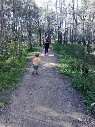 S and XYL on a bush track trying to keep up