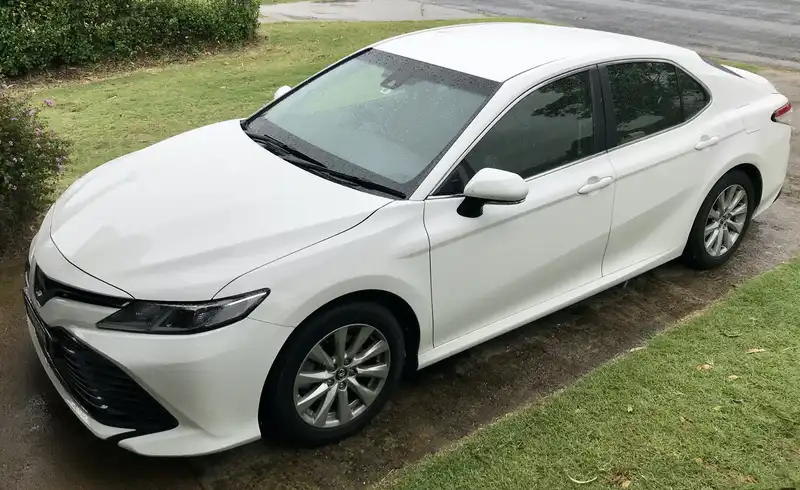 white camry in the driveway after a 800km roadtrip